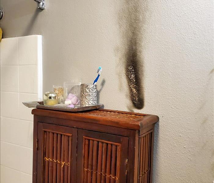 The results of a fire cause by a candle being too close to the wall of a San Diego home